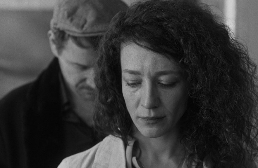 A woman turning her back to her partner in resignation