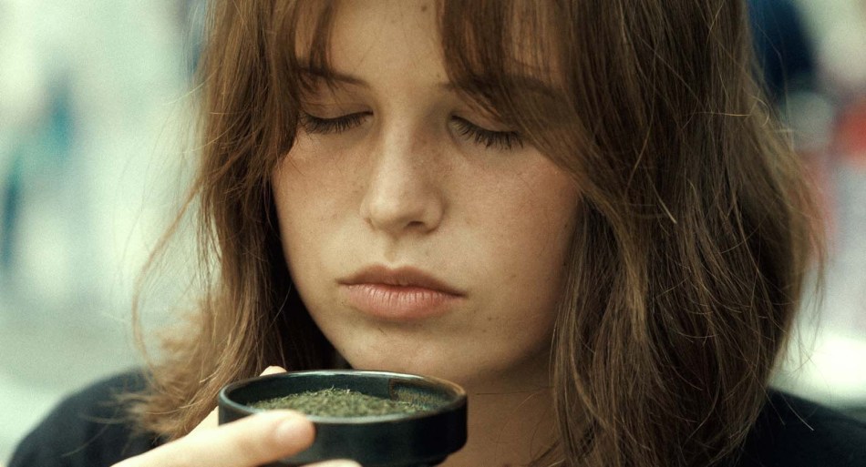 Young girl tasting spices