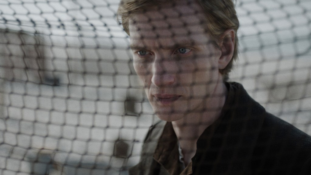 Hein, seen through a fishing net