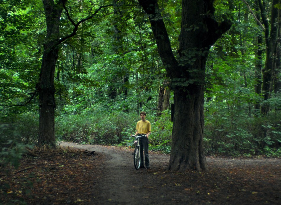 Carla in the park, stand with her bicycle
