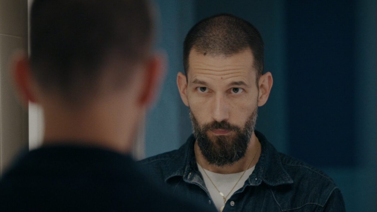 director Marcel Wyss looking in mirror