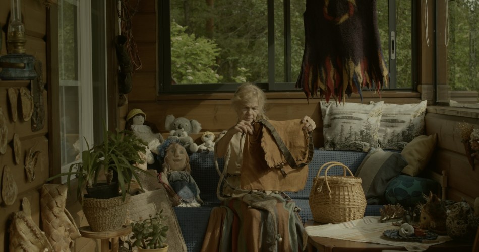 Elderly woman holding bag