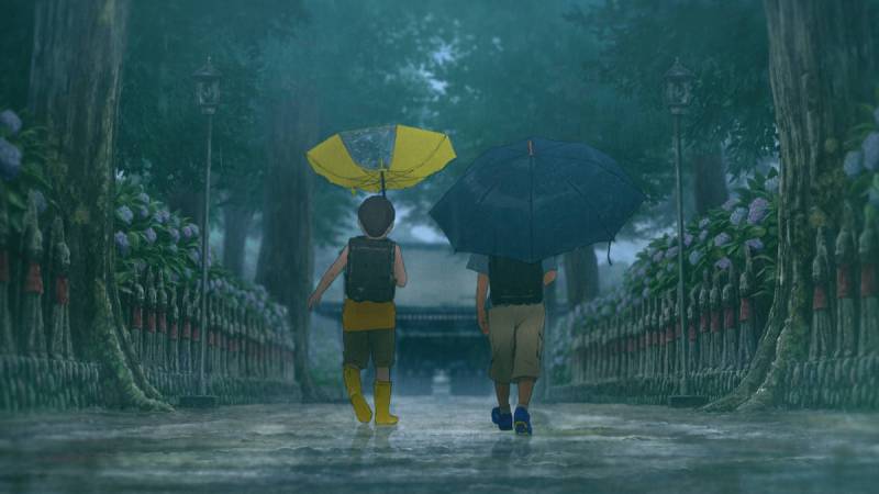 Two boys walking in the rain