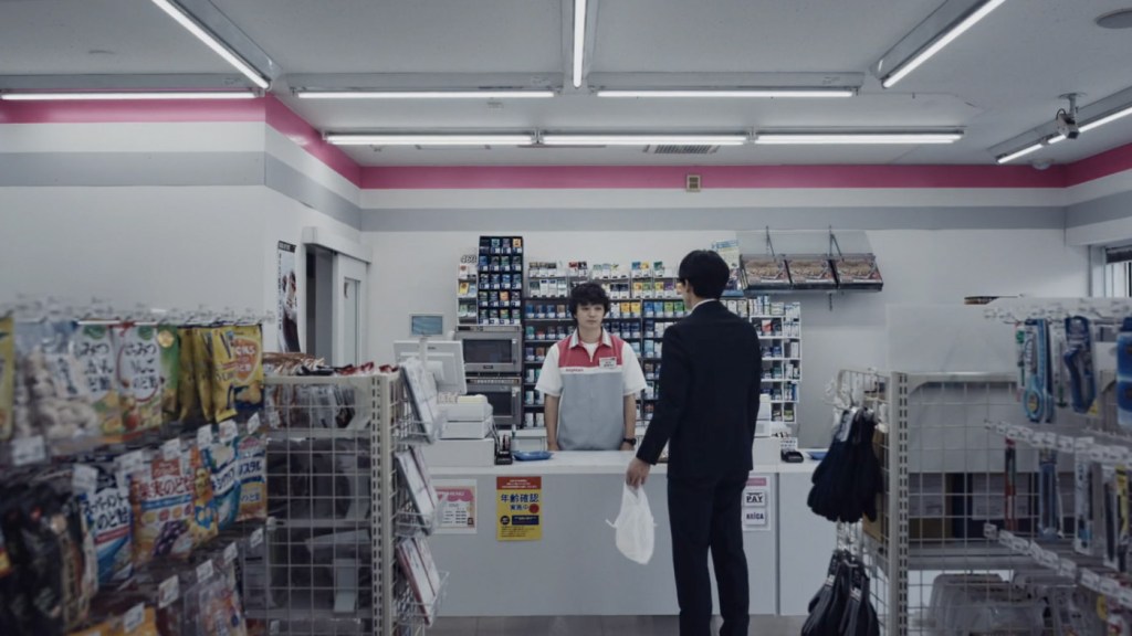 Sakai behind counter in konbini