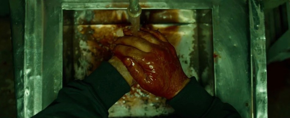Killer washing his bloody hands