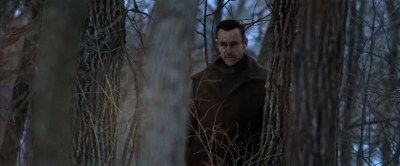 Vampiric guy watching from the forest